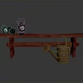 Red Wooden Bench With Two Black Oil Lamps And Brown Watering Can