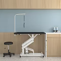 Adjustable Medical Treatment Table With Black Top Stool Cabinet Supplies And Light Blue Wooden Wall