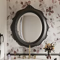 Round Black Carved Frame Mirror On Floral Wallpaper With Flower Bouquet And Towel Rack