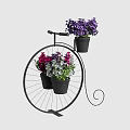 Colorful Flowers In Black Pots On Decorative Iron Bicycle Planter Stand