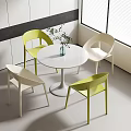 Modern Round White Table And Chair Set With Yellow White Chairs Potted Plant By Window
