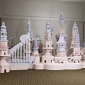 Detailed Castle Model Featuring Towers Wing like Structures and Railings in Indoor Space