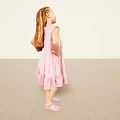 Man Wearing Pink Outfit Standing Against Light Background With Hands On Hips And Sandals