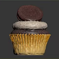Chocolate Cupcake With Yellow Paper Liner White Cream Frosting And Oreo Cookie Topping