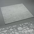 Square Gray Rug With Intricate Geometric Patterns And Textured Surface Design