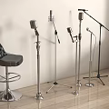 Vintage Microphones With Metal Stands And Black Leather Bar Stool In Studio