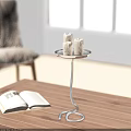 Candle Lamp With Three Lit Candles On Wooden Table Near Open Book In Cozy Setting