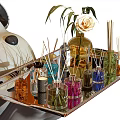 Perfume Cosmetics Collection On Metal Tray With Aromatic Bottles Reed Diffusers Candles And White Rose