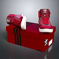 Adidas Red High Top Shoes with Red Laces on Red Shoe Box with Black Stripes