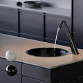 Modern Black Silver and White Faucet with Water Flowing on Kitchen Countertop