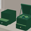 Two Open Green Boxes With Tea Inside Placed On White Table 3d model