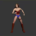 Woman in Red Blue Superhero Costume with Gold Accessories and Red Boots Action Pose