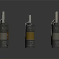 Multiple Cylindrical Weapon Components With Yellow Orange Gray Sections On Dark Surface