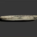 Ancient Circular Stone Sculpture With Radial Patterns And Detailed Carved Edges