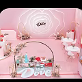 Dove Exhibition Display With Pink Background Floral Arch And Decor Items