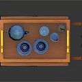 Orange Dining Cart With Blue Teapot Tea Cups And Chopsticks Container