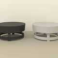 Two Round Black And White Stools With Simple Minimalist Base Design