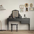 Black Dressing Table with Mirror Stool Gold Framed Pictures and Floor Lamp in Interior