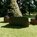 Black and Red Sofa Coffee Table Set on Green Lawn with Lush Greenery and Trees