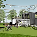 Outdoor Container Building Lounge Area With Lawn Tables Chairs And Decorative Lights