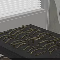 Brass Cabinet Door Handles With Various Designs Displayed On Wooden Board