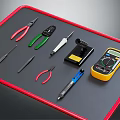 Essential Hardware Tools Collection Including Pliers Screwdrivers Multimeter Tweezers on Black Mat with Red Border