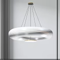 Modern White Circular Ribbed Pendant Light Hanging In Minimalist Interior Space