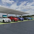 Electric Vehicle Charging Station With White Canopy And Multiple Colored Cars On Green Ground