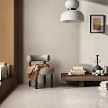 Gray Accent Chair With Armrest And Brown Coat Draped By Wooden Coffee Table With Books