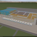 Modern Industrial Factory Large Structure With Colorful Roof Multiple Workshops And Green Surroundings