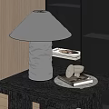 Crinkled Metallic Table Lamp on Dark Wooden Table with Tray Book and Small White Object