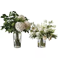 White Roses and Hydrangeas in Glass Vases with Green Leaves and Branches