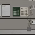 Green And White Calendars Hanging On White Wall With Potted Plant And Bookshelf