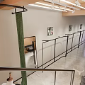 Modern Clothing Store Interior With Black Metal Frames White Walls Art Paintings And Green Plants