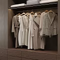 Neatly Arranged Neutral Toned Coats And Dresses In Modern Wooden Wardrobe With Drawers