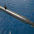 Modern Military Submarine With Dark Hull And Conning Tower Floating On Blue Sea Surface