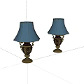 Two Elegant Table Lamps With Light Blue Shades And Ornate Brass Bases