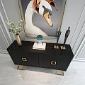 Elegant Black Console Table With Golden Legs Framed Painting And Wall Sconces On Gray Wall