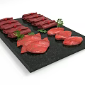 Raw Meat Platter Rolled And Sliced On Black Slate Plate Garnished With Green Herbs