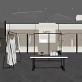 Ladies Clothing Store Interior With Fashion Display Hanging Dresses Display Table And Lighting
