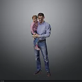 Happy Child in Pink Top Being Held by Father in Blue Shirt Against Gray Background