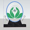 Garden Ornament With Circular Design Green Leaves Silver Spherical Decorations And Black Marble Base
