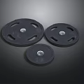 Black Weight Plates In Three Different Sizes For Home Daily Fitness Use
