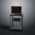 Old Style Computer Monitor On Wheeled Cart With Lower Shelf Equipment