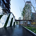 Colorful Garden Landscape With Winding White Walkway Blue Pink Pavement Trees And Play Facilities