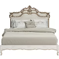 Classic European Style Double Bed With Ornate Carved Headboard Light Colored Bedding And Patterned Details
