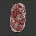 Fresh Raw Marbled Beef Steak on Black Surface with Red White Texture