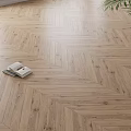 Herringbone Pattern Wooden Flooring in Light Wood Tone with Natural Texture and Open Book
