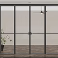 Modern Sliding Glass Doors With Black Frame In Indoor Space And Potted Plant