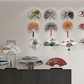 Decorative Fan Wall Hangings With Various Traditional Designs On Wall And Cabinet